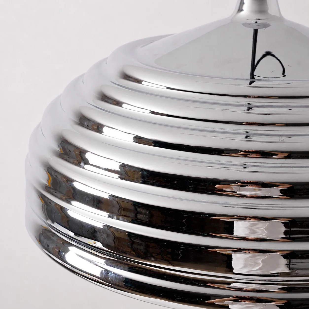 Close view of the ribbed polished chrome dome shade