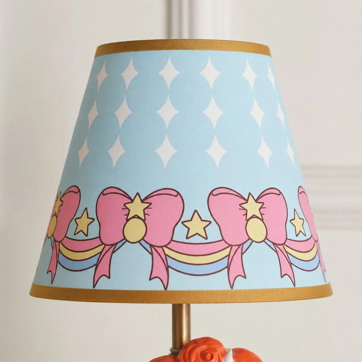 Blue printed fabric shade detail with bows and stars