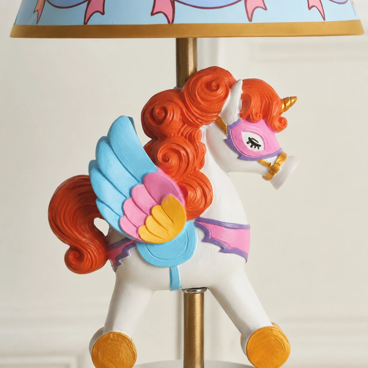 Close view of colorful unicorn carousel ornament detail