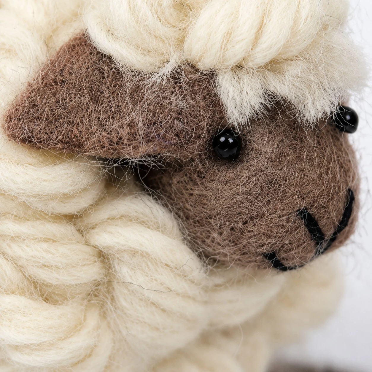 handmade wool sheep back view with cream curled fleece