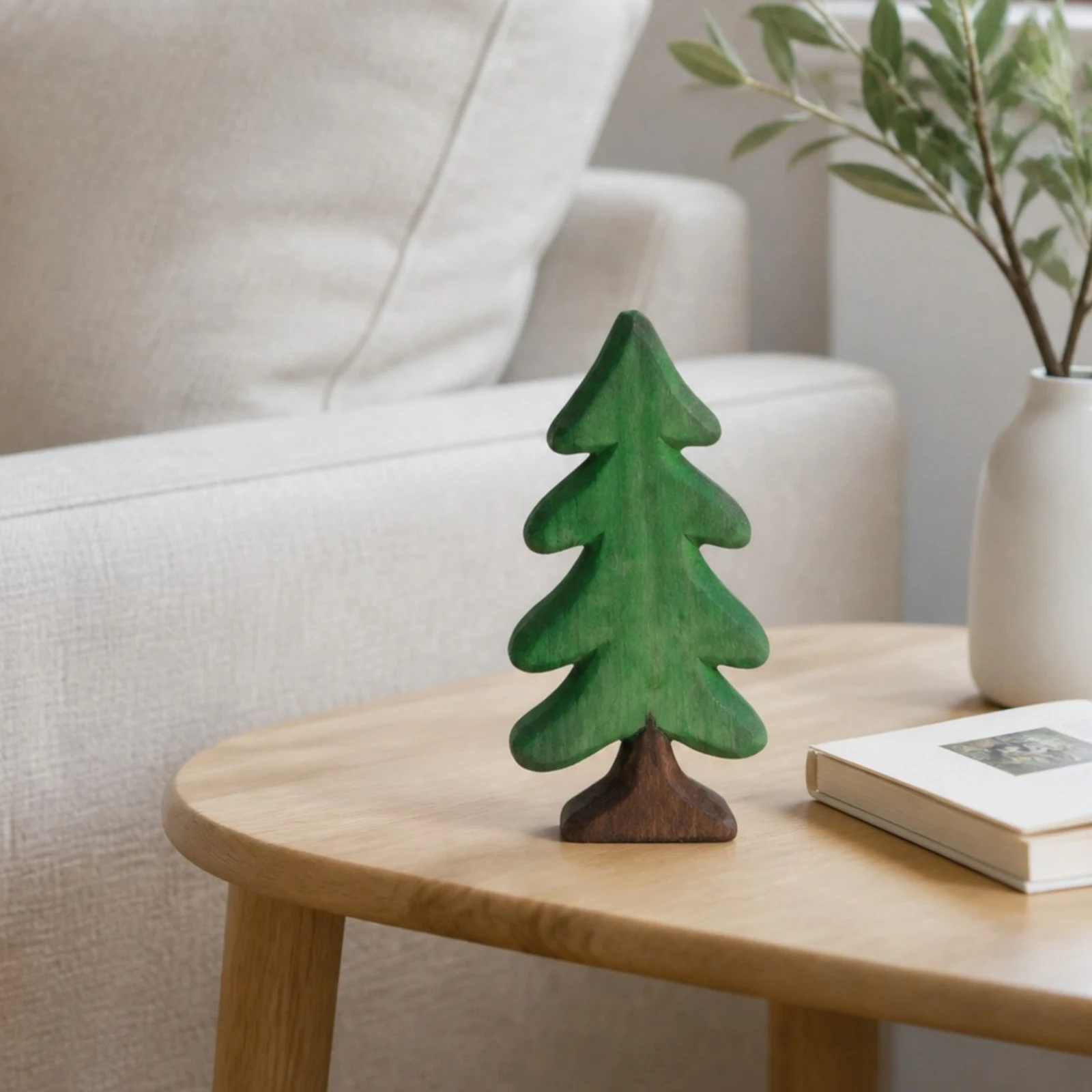 Small pine tree ornament in a living room setting