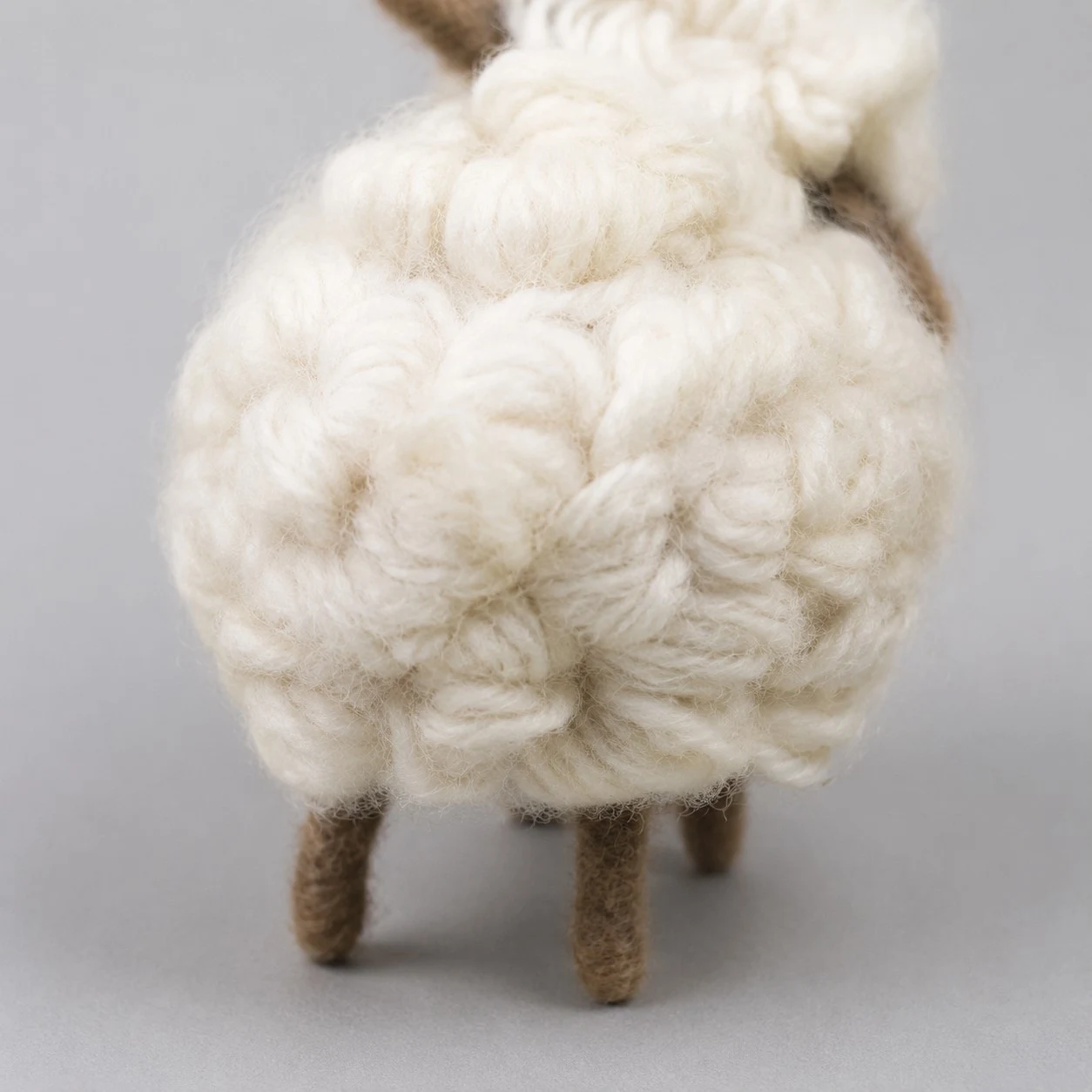 curled cream wool fleece with brown felt face detail