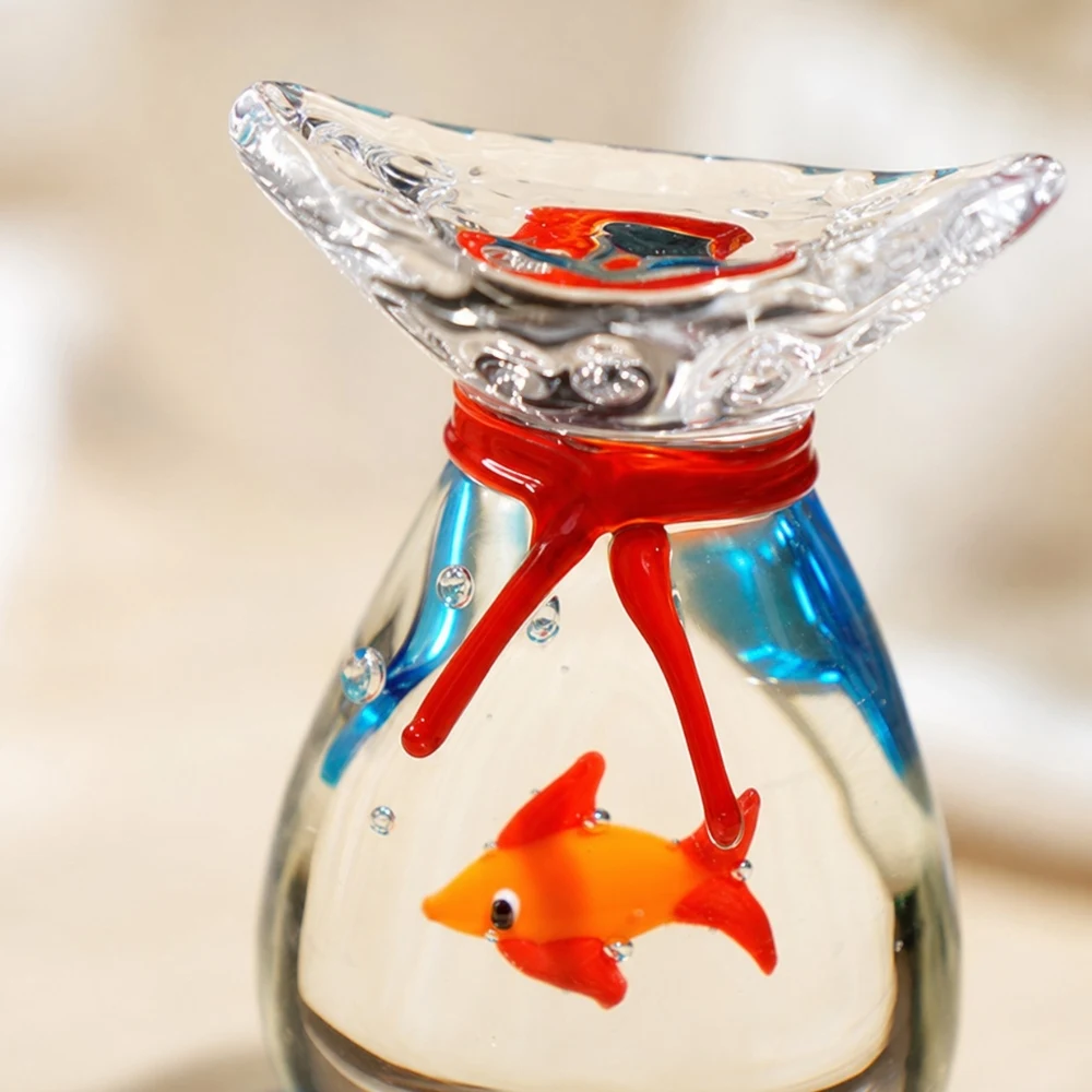 Close detail of rounded glass goldfish ornament rim