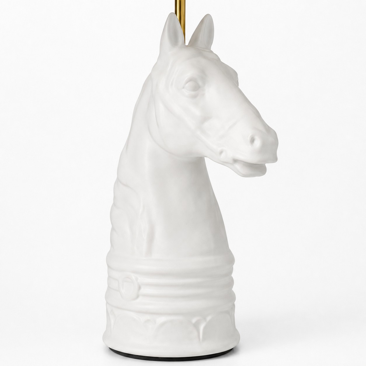 Close detail of white horse head table lamp base