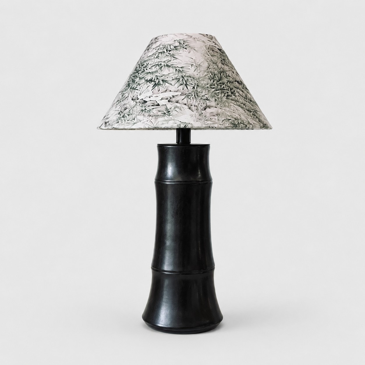 Dark brown ceramic table lamp with botanical shade