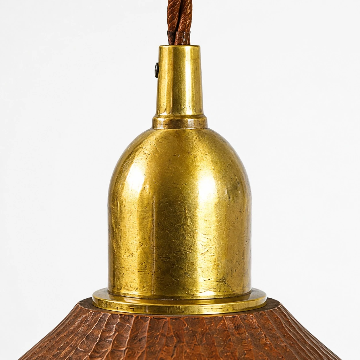 Brass lamp holder and carved wood shade connection detail