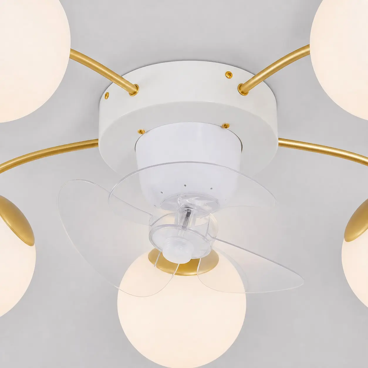 White and gold ceiling fan light in a modern interior