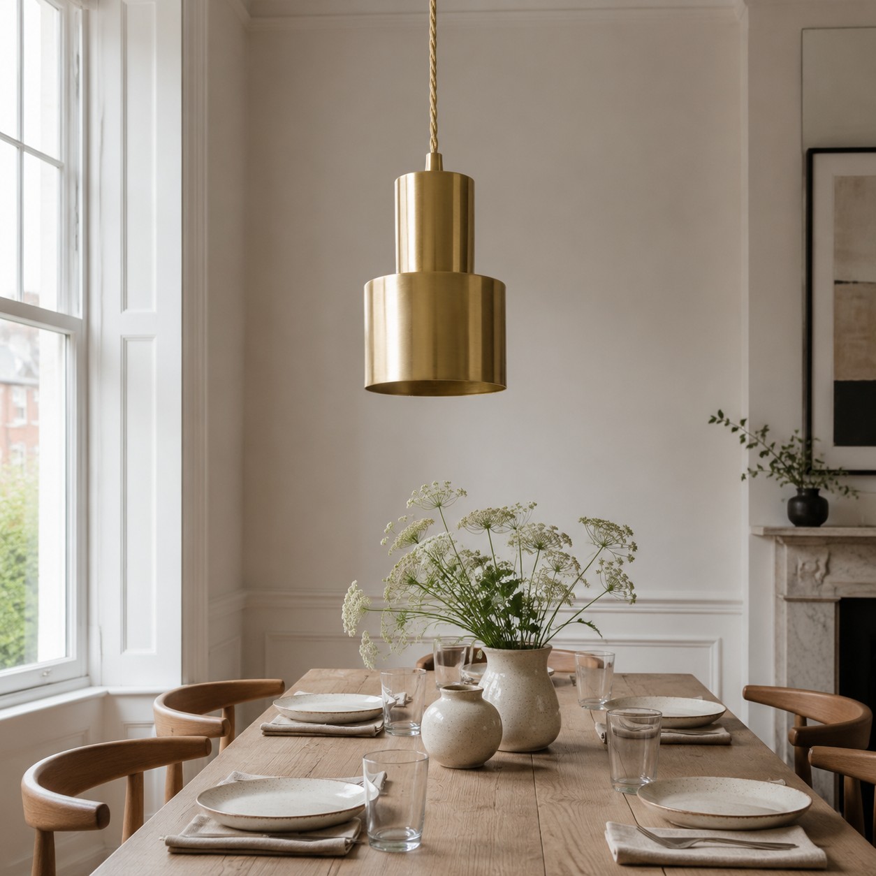 Vintage brass pendant lamp above a dining table