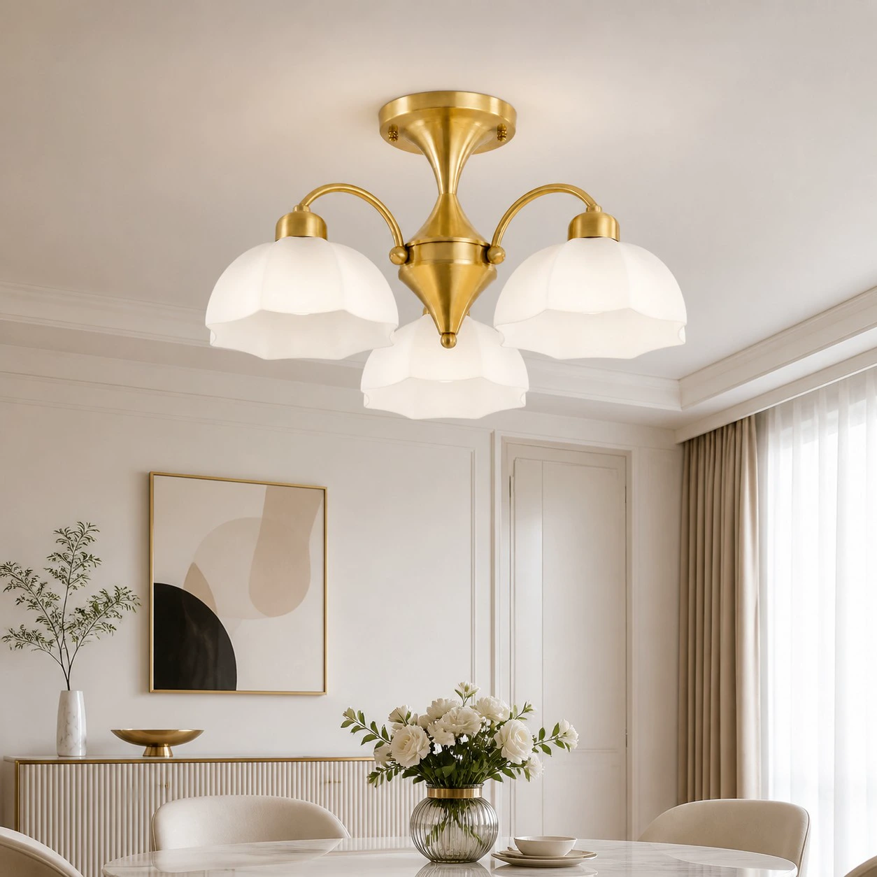 Gold three-light chandelier in a refined dining room