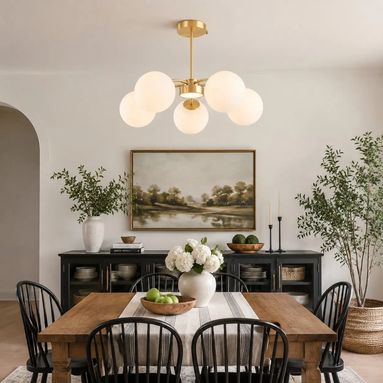 Gold five-light chandelier in a dining room