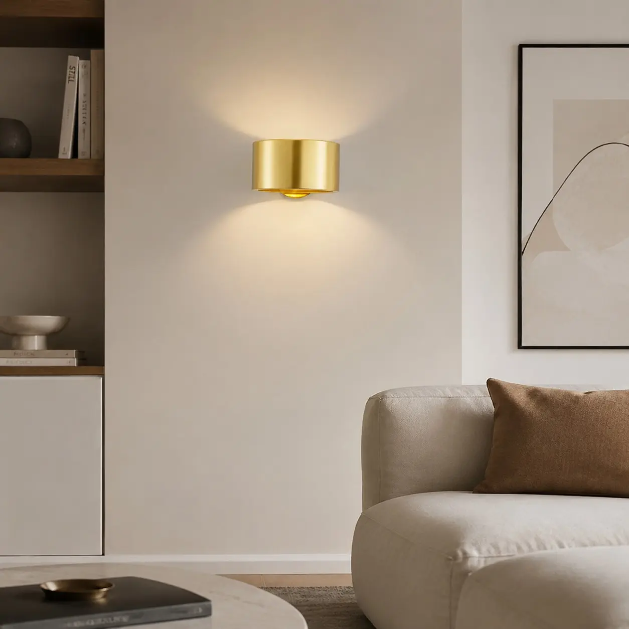 Gold brass wall sconce installed in an interior