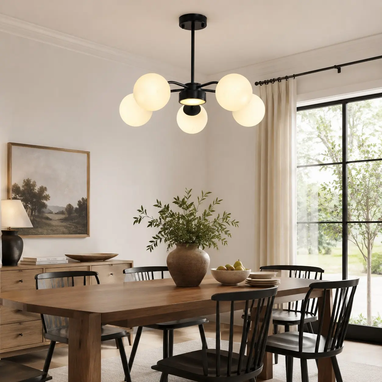 Black five-light chandelier above a dining table