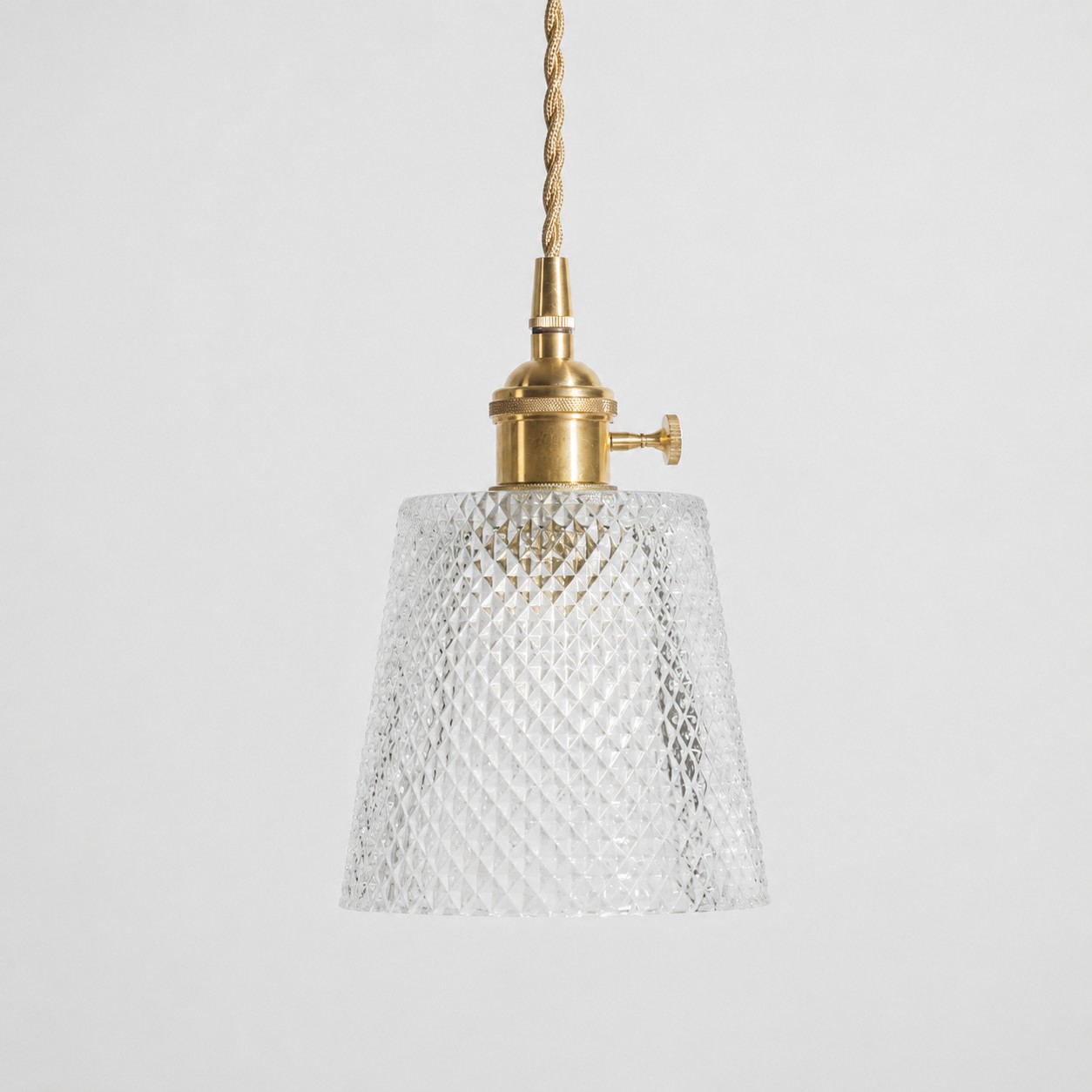 Style A textured glass shade with antique brass E27 socket, front view