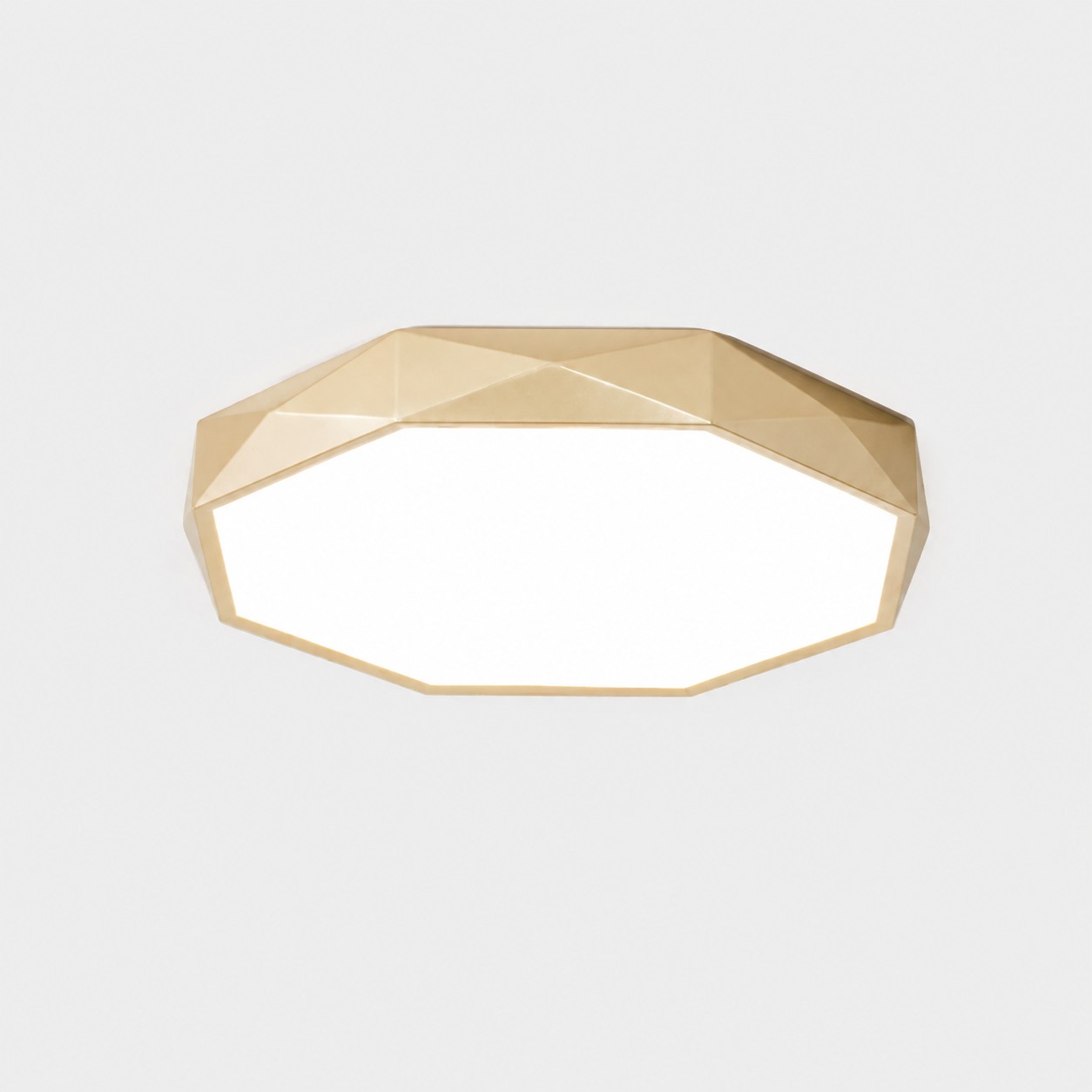 Gold polygon ceiling light in white light mode