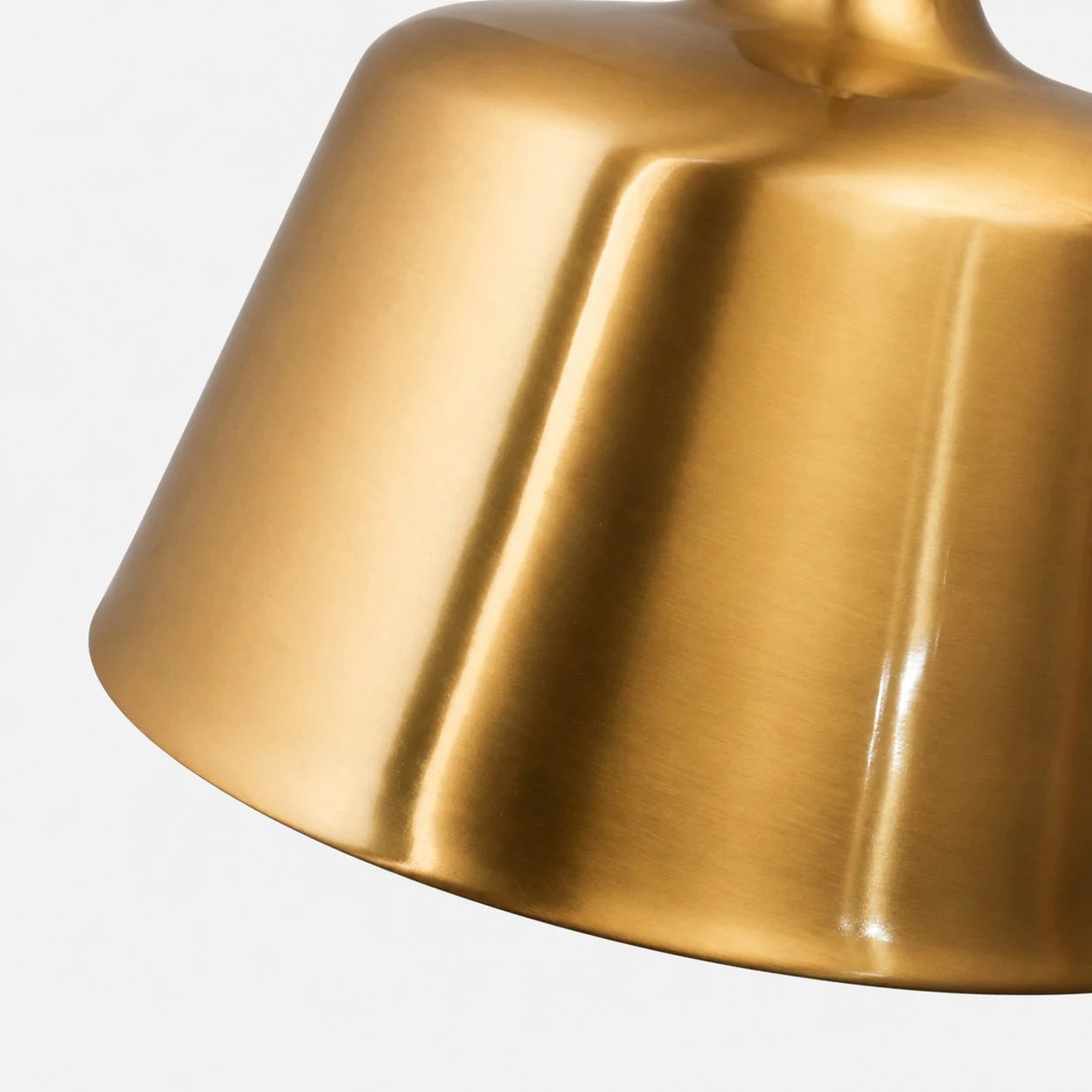 Close view of the shaped brass pendant shade