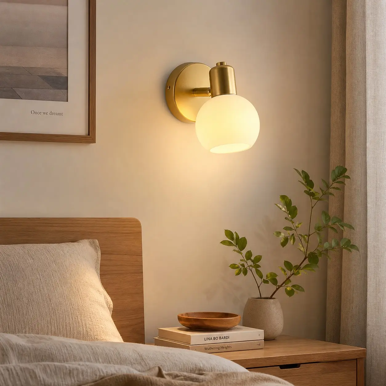 Single-light wall sconce beside a bed