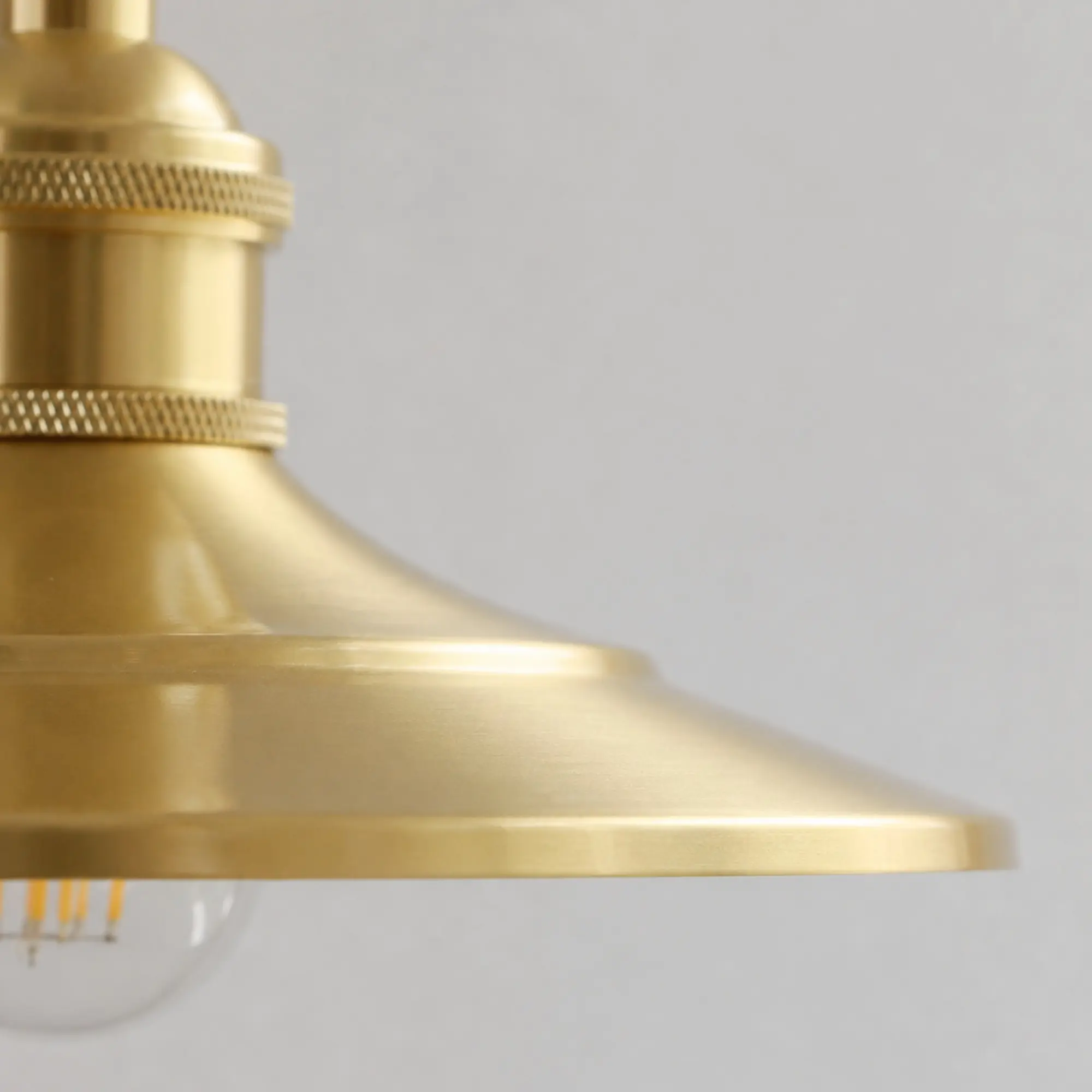 Close-up of the smooth polished brass shade edge