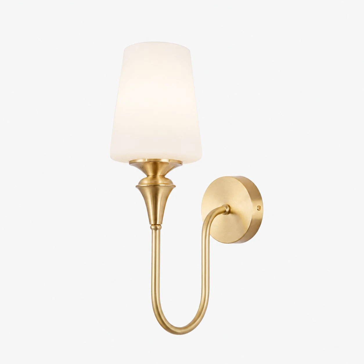 Antique brass wall sconce with opal glass shade