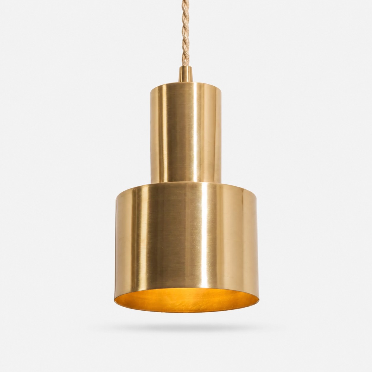 Tiered vintage brass copper pendant lamp on white background