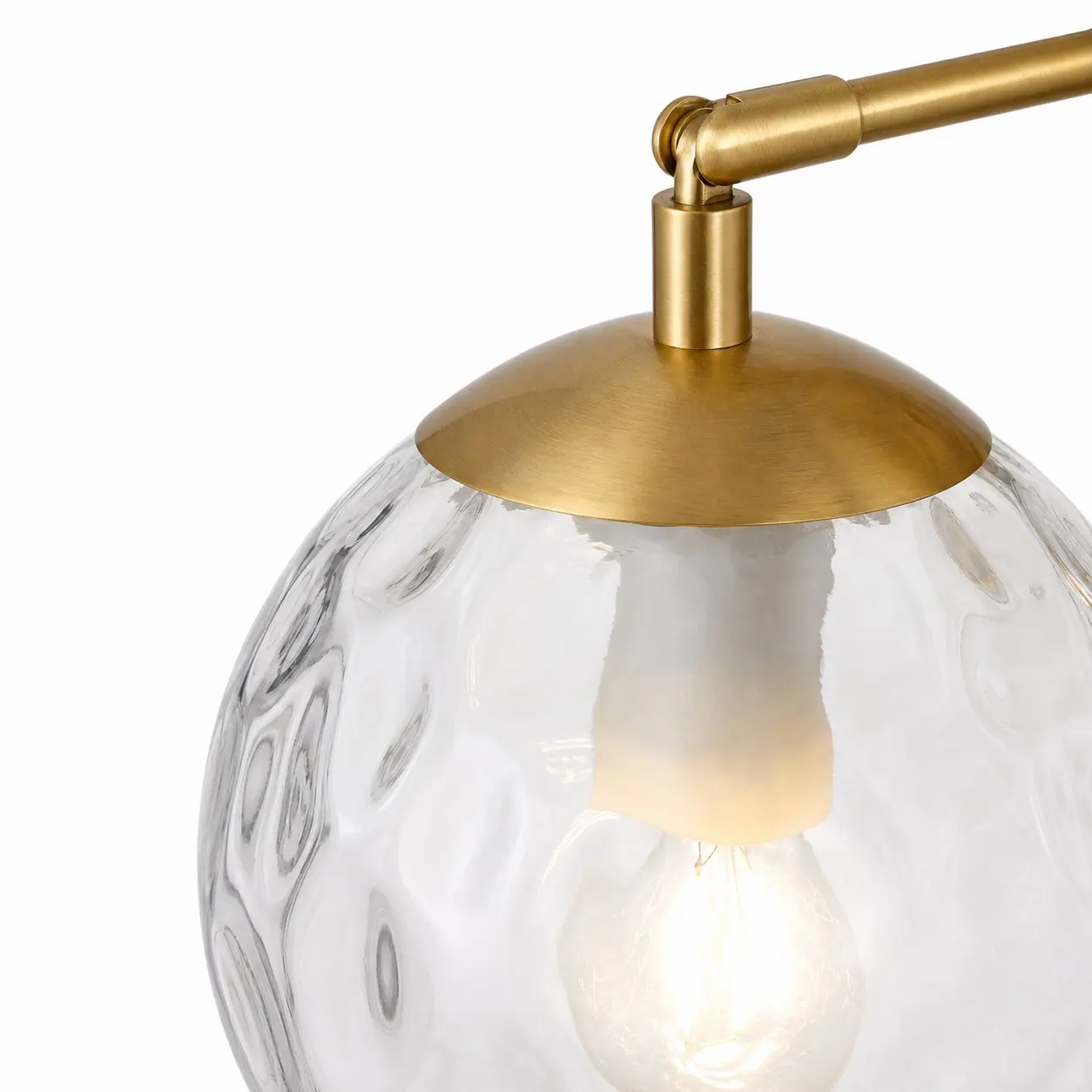 Close view of the rippled glass texture and gold shade cap