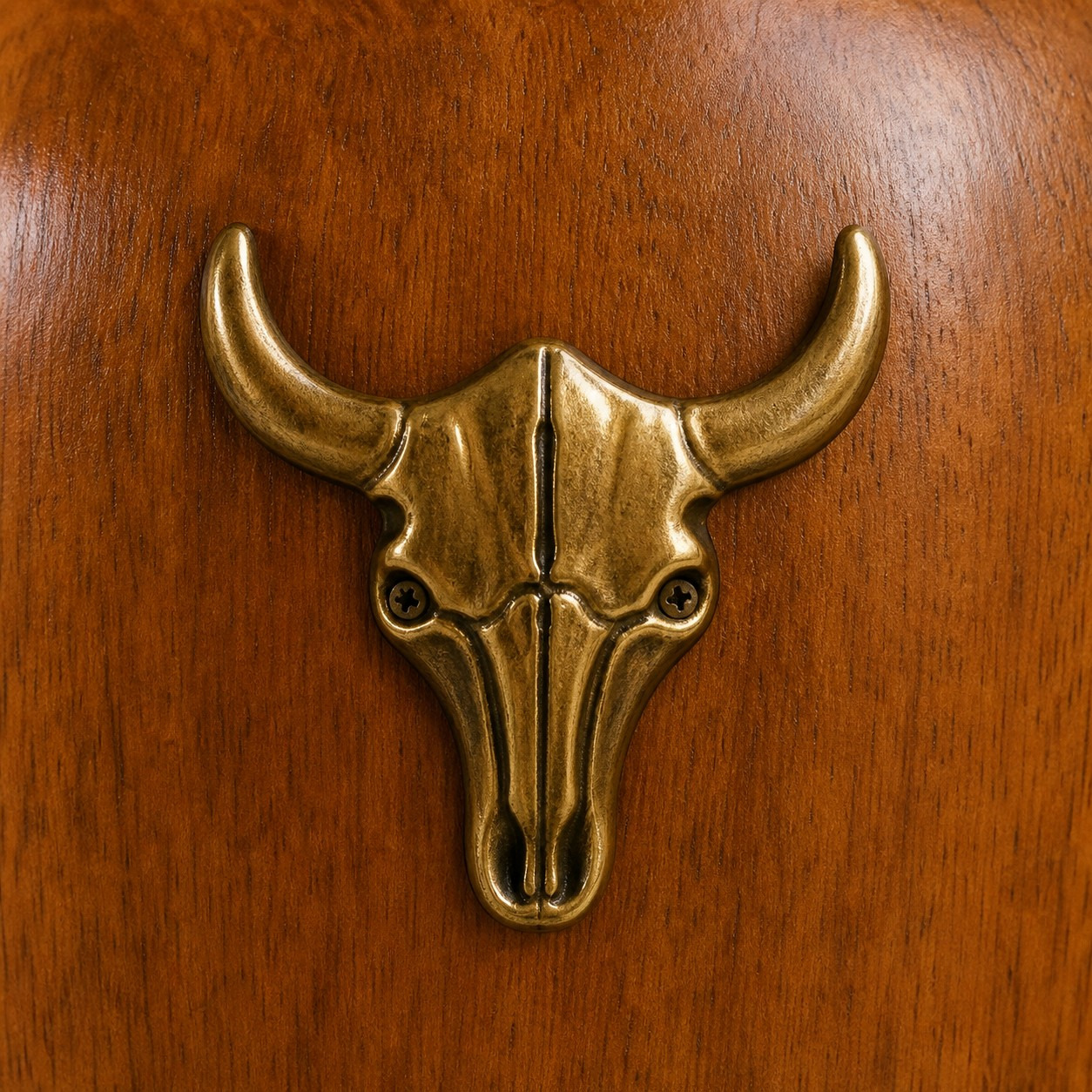 Brass bull-head accent on the wood lamp body