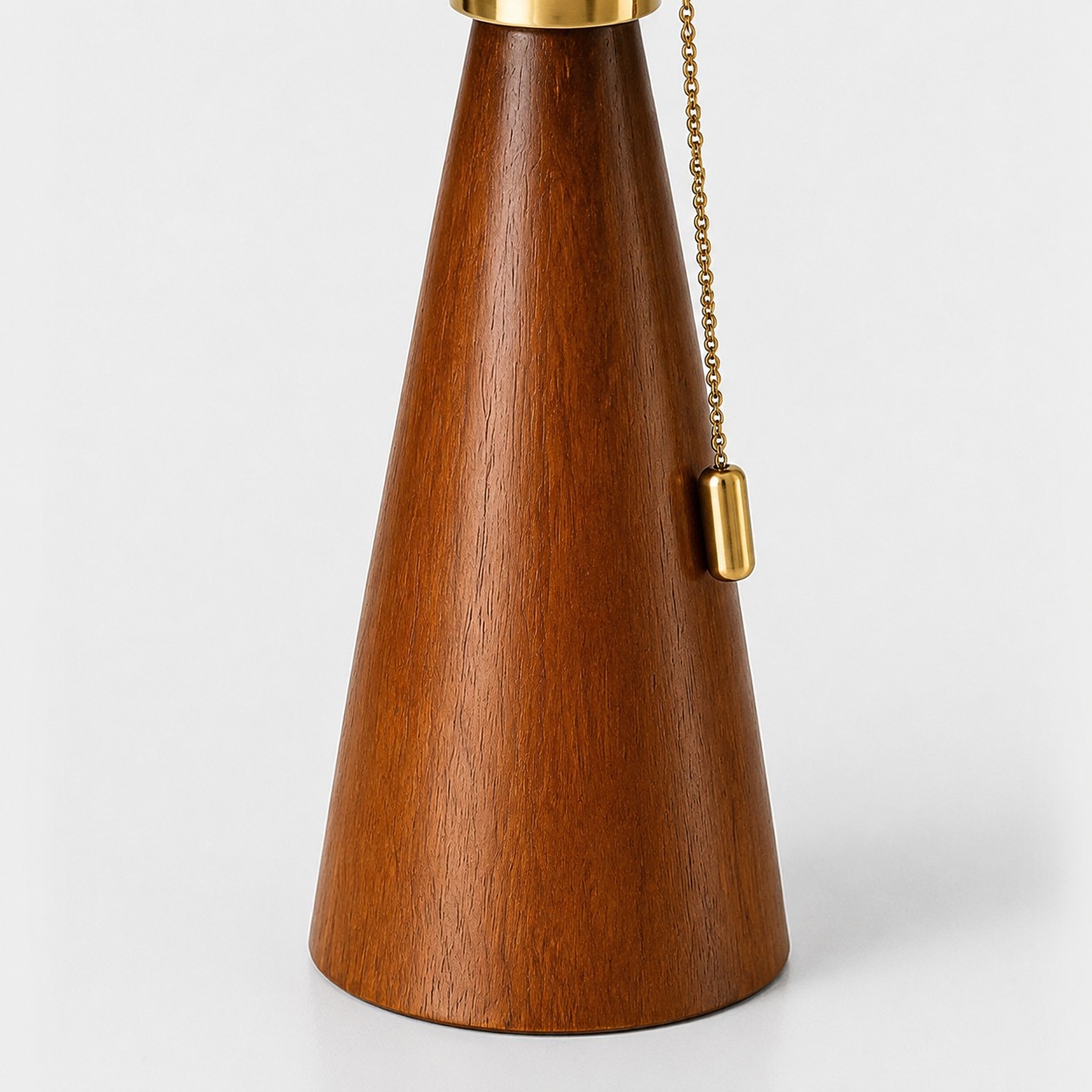 Detail view of the wood lamp body and pull chain