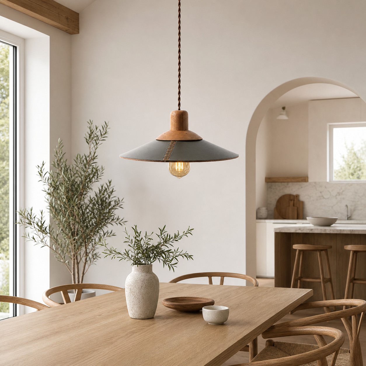 Dark green leather pendant above a dining table