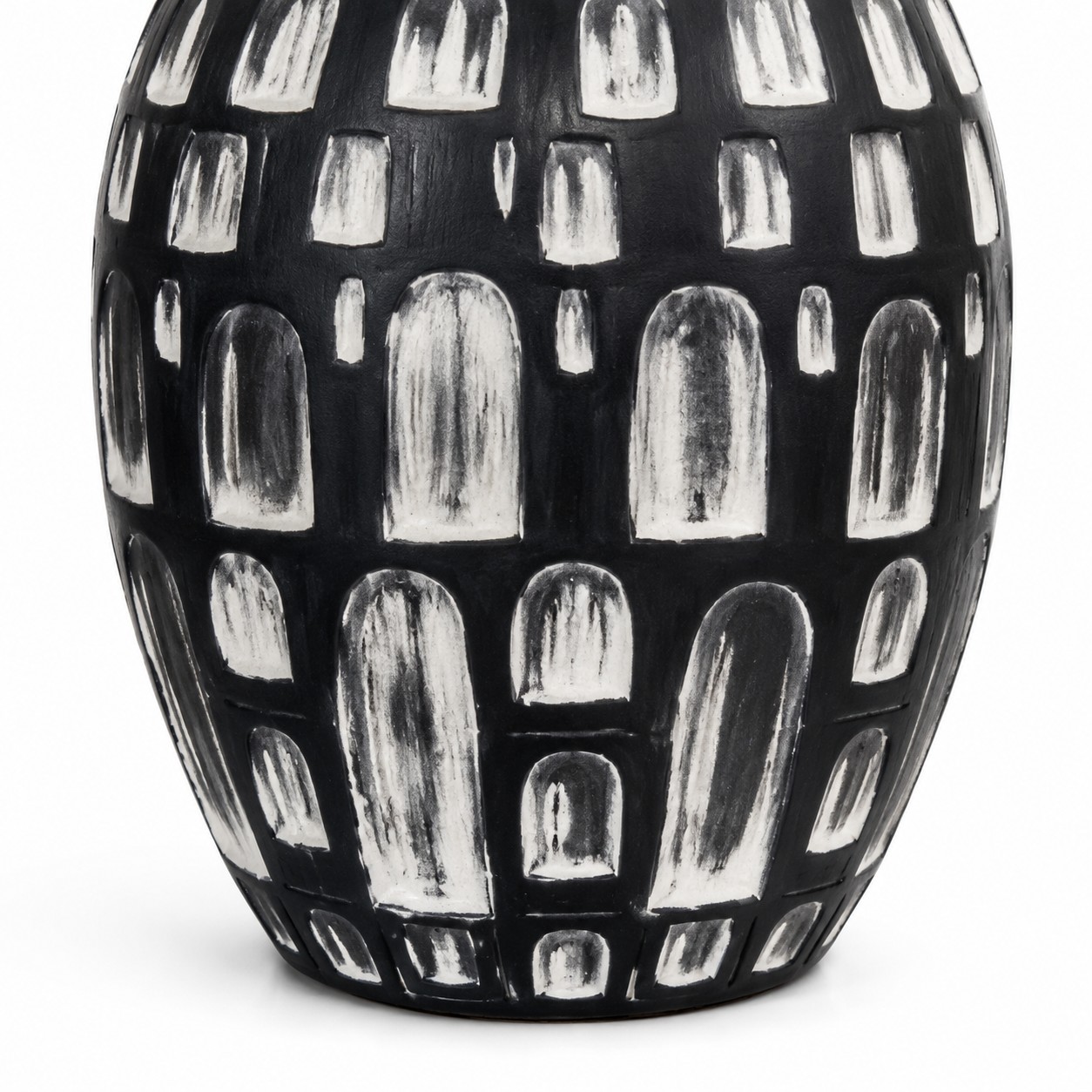 Black and white hand-finished ceramic base detail