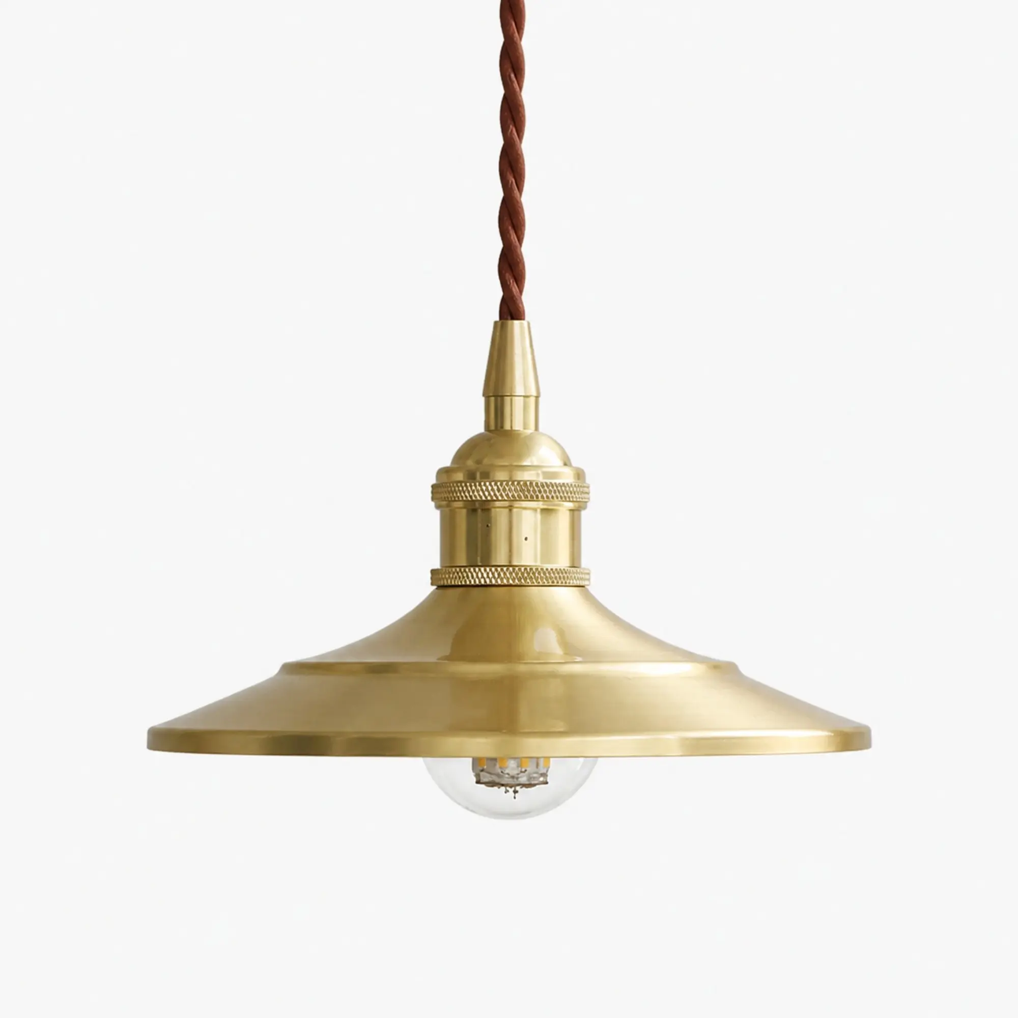 Vintage polished brass pendant light on a clean white background