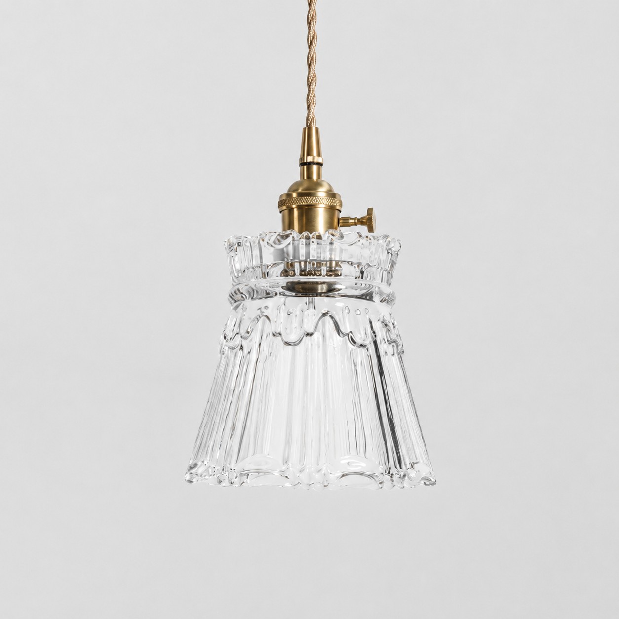 Style M - Clear textured glass shade with antique brass E27 socket, front view