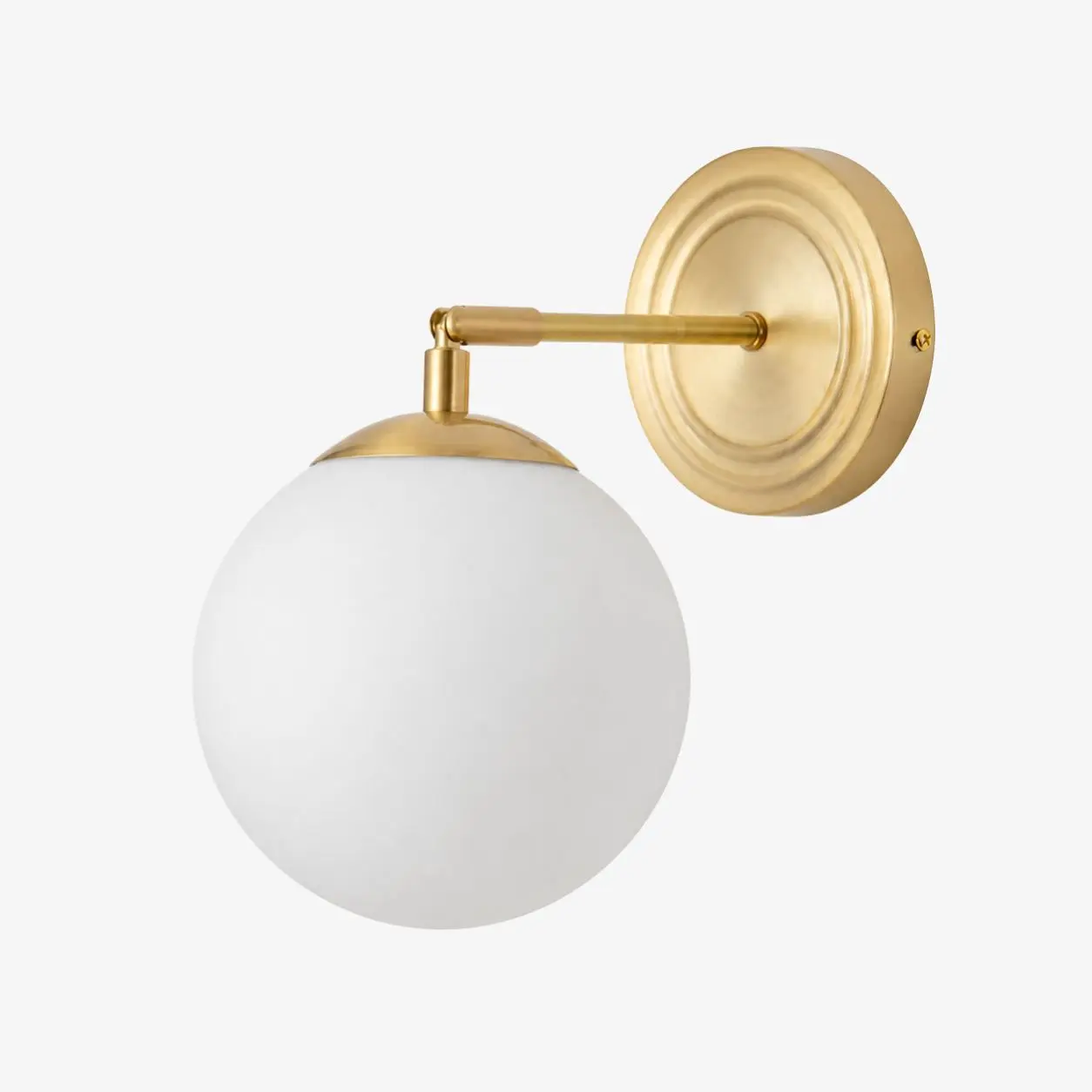 Gold wall lamp with a round milk glass shade