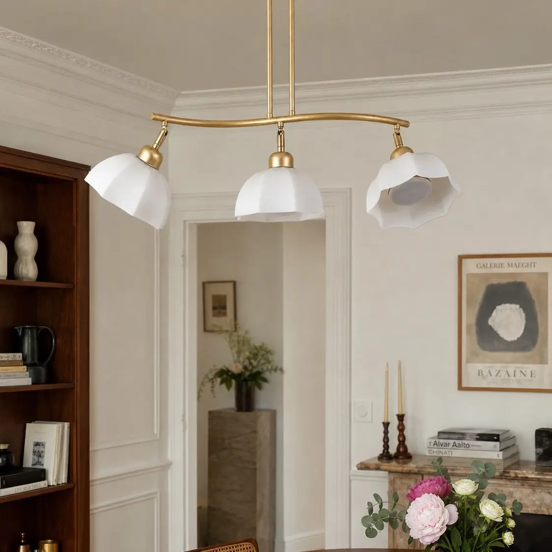 Three-light chandelier installed above a dining area