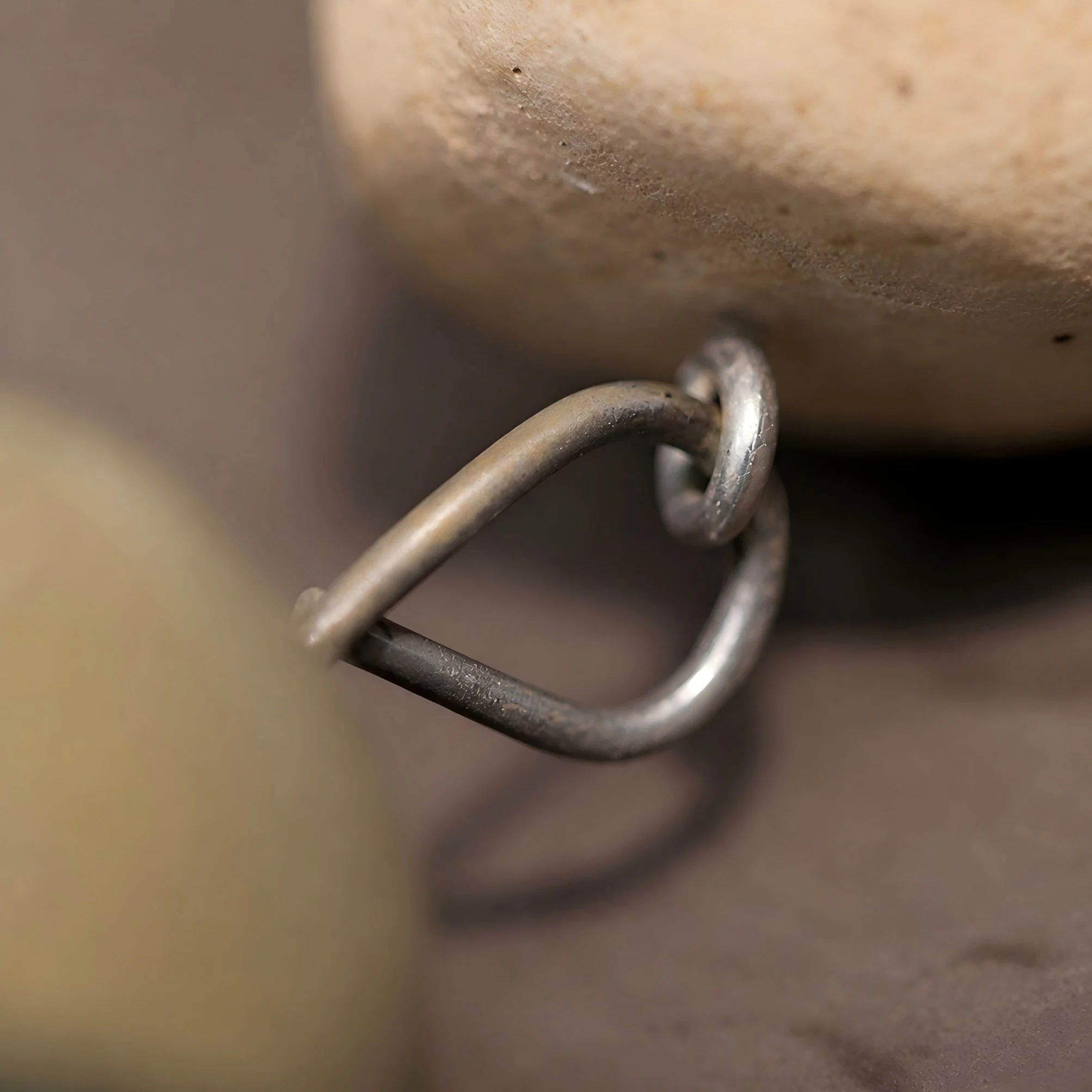 Close-up of metal connector hardware on the wind chime