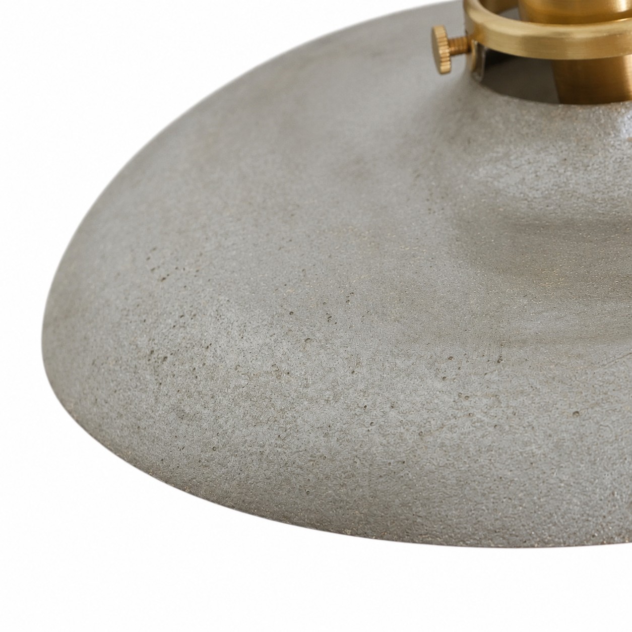 Brass-toned lamp holder and shade connection detail