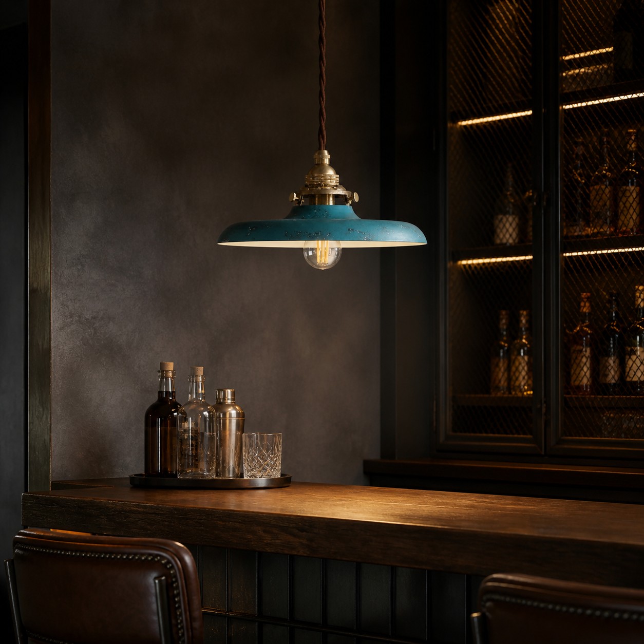 Distressed blue pendant light above a compact bar counter